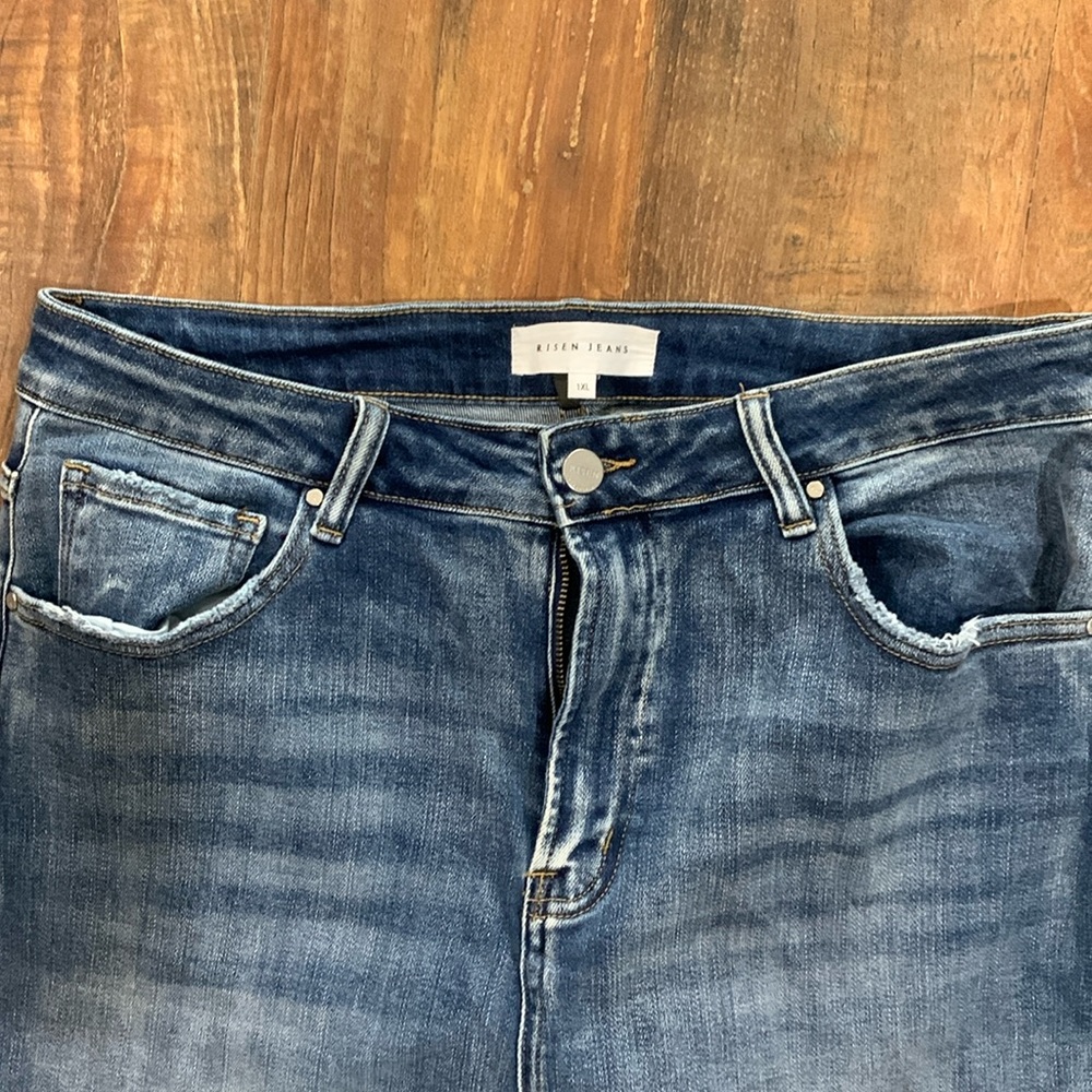 Risen “mom” jeans. Slight distressing.